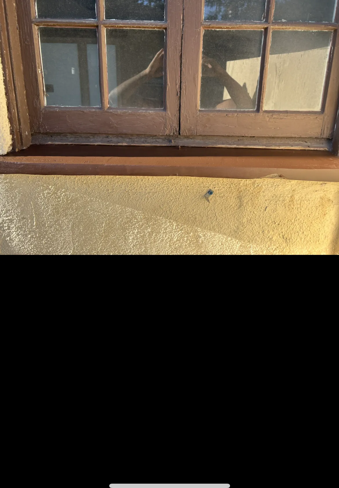 Repaired and stained window frame