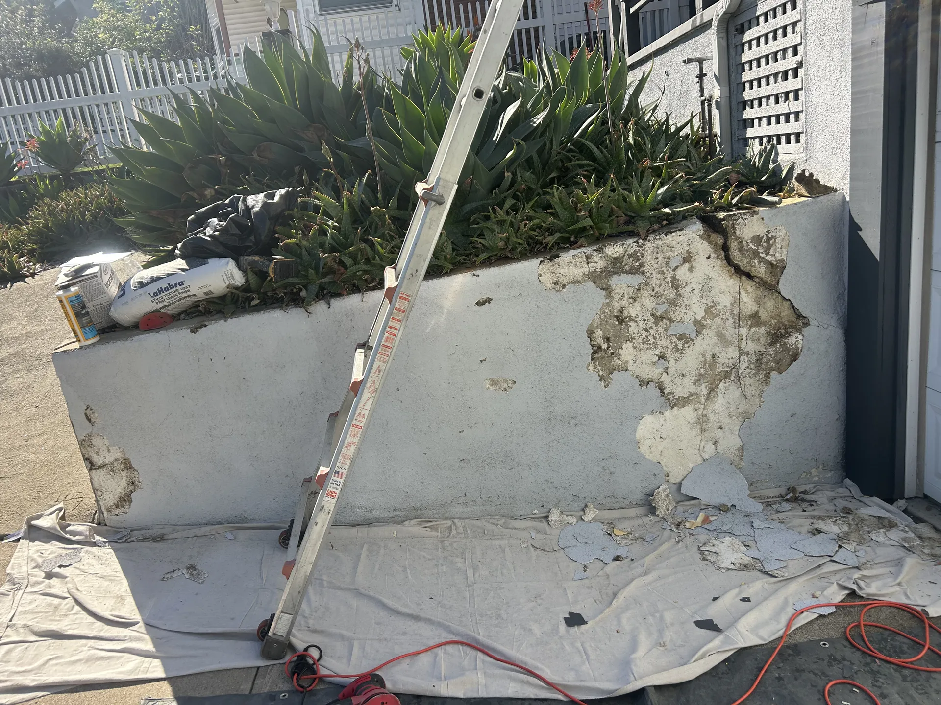Peeling stucco wall before paint