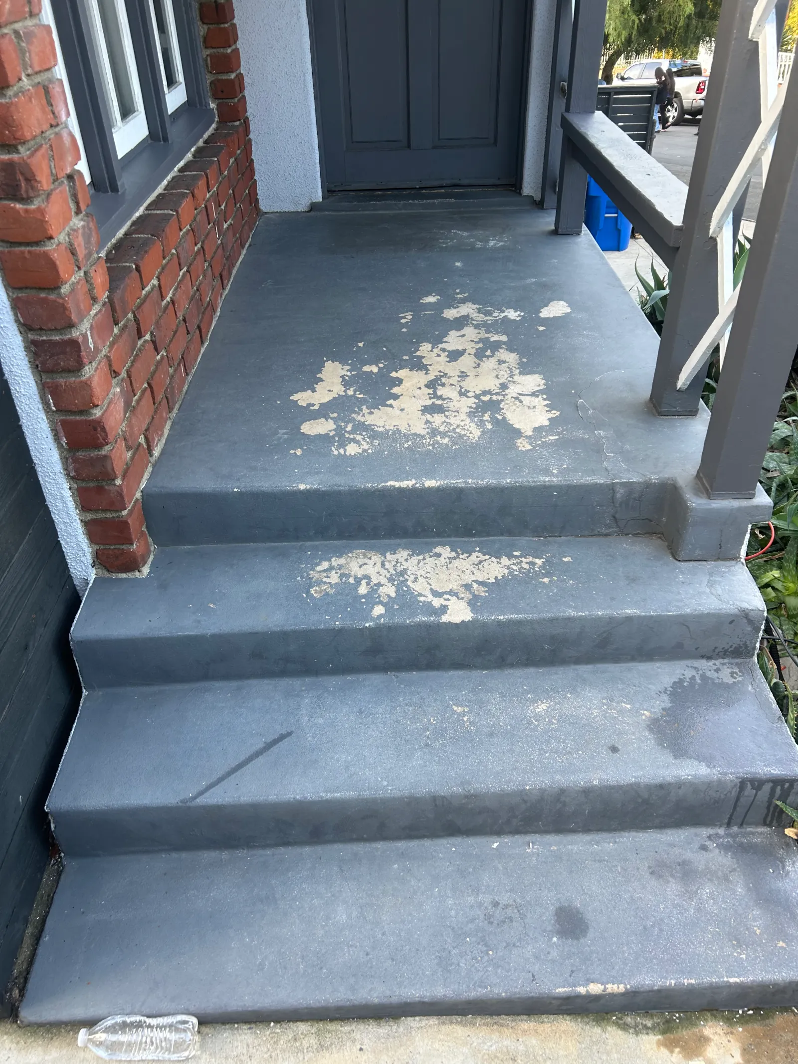 Stucco wall before charcoal paint finish