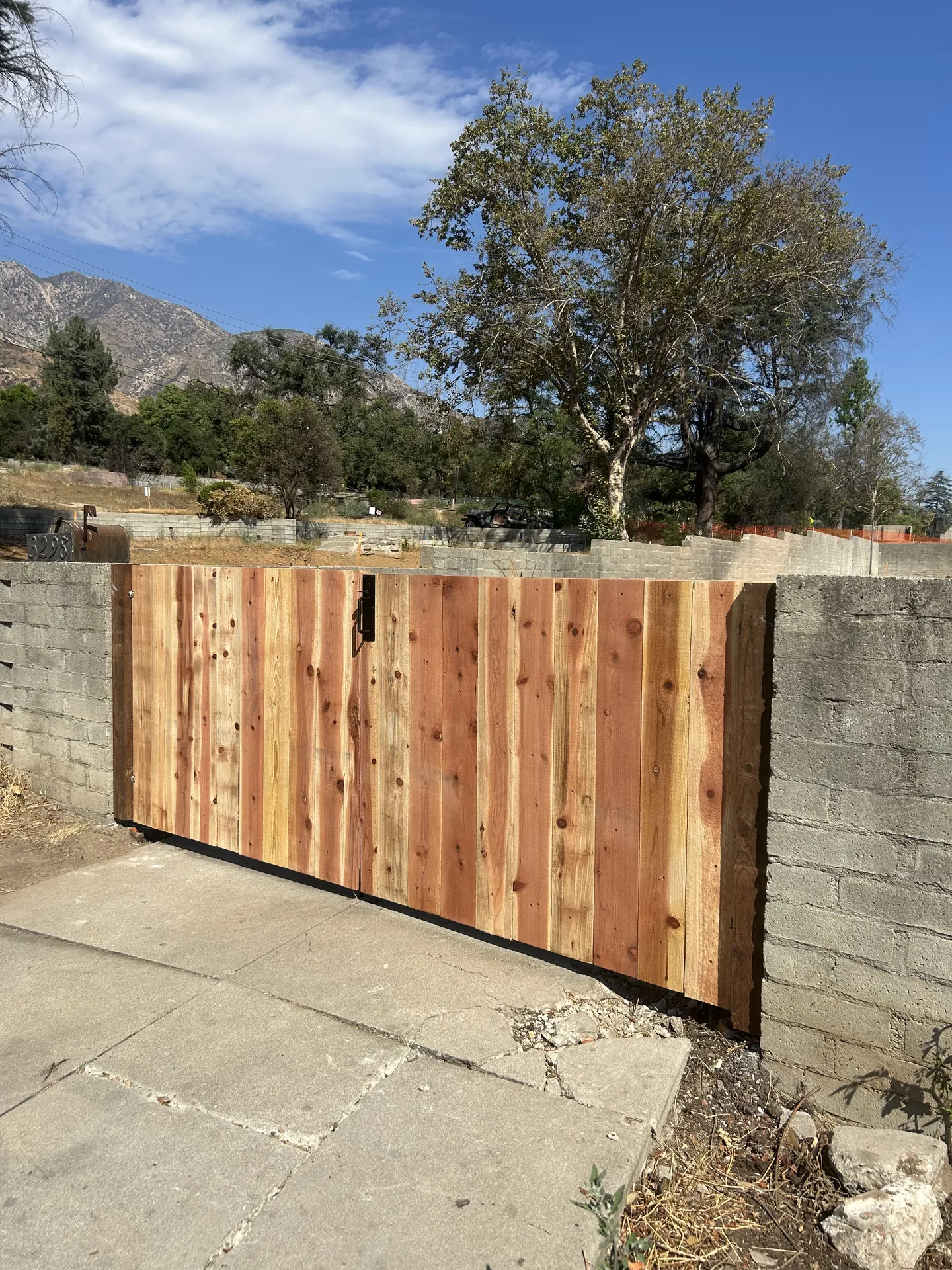 Cedar fence mounted on existing block wall