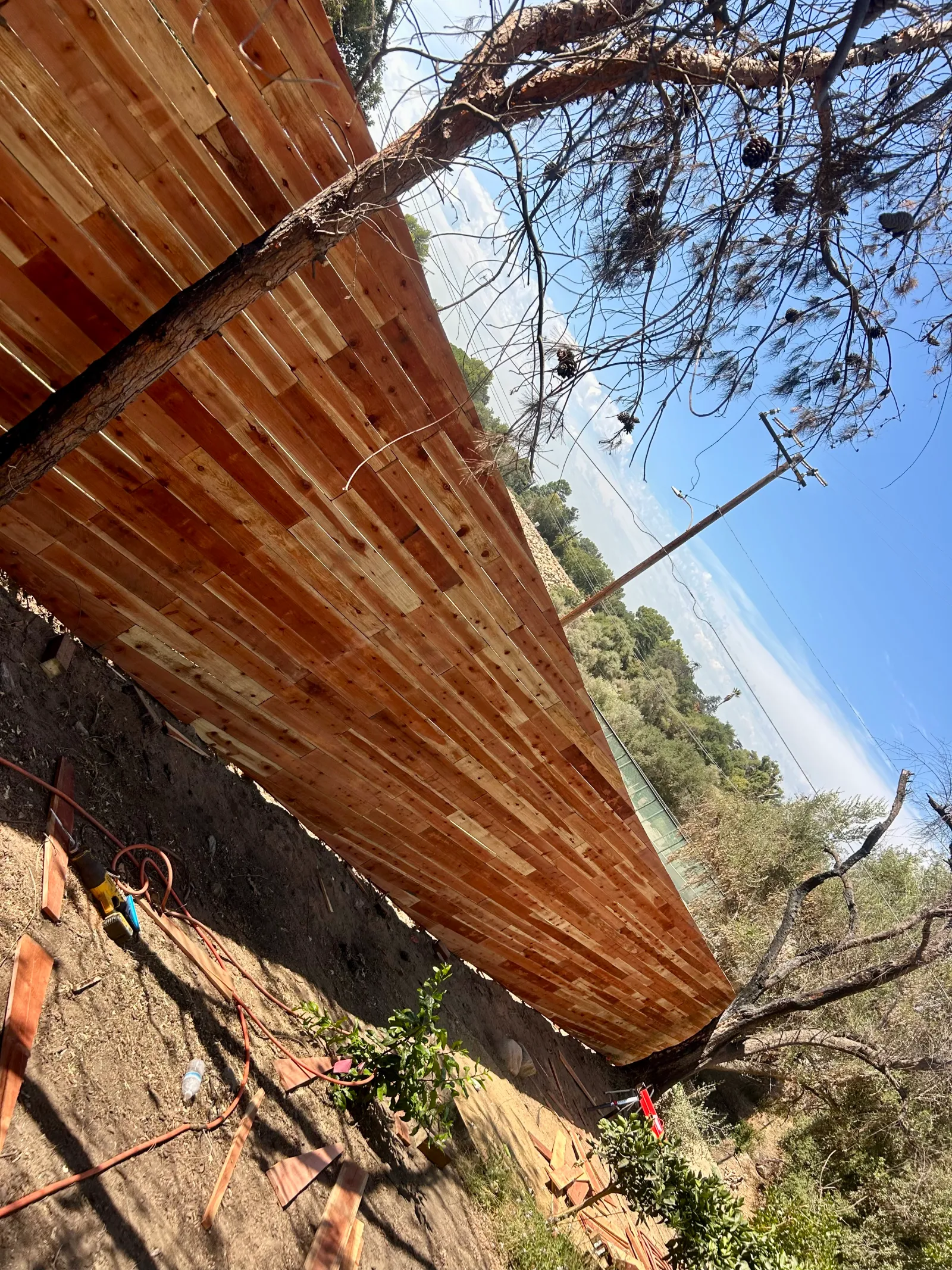 Horizontal cedar fence on hillside property