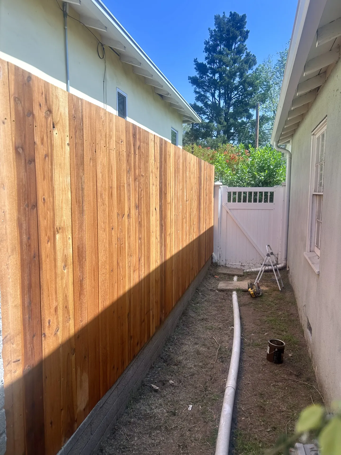 Vertical board cedar fence in side yard