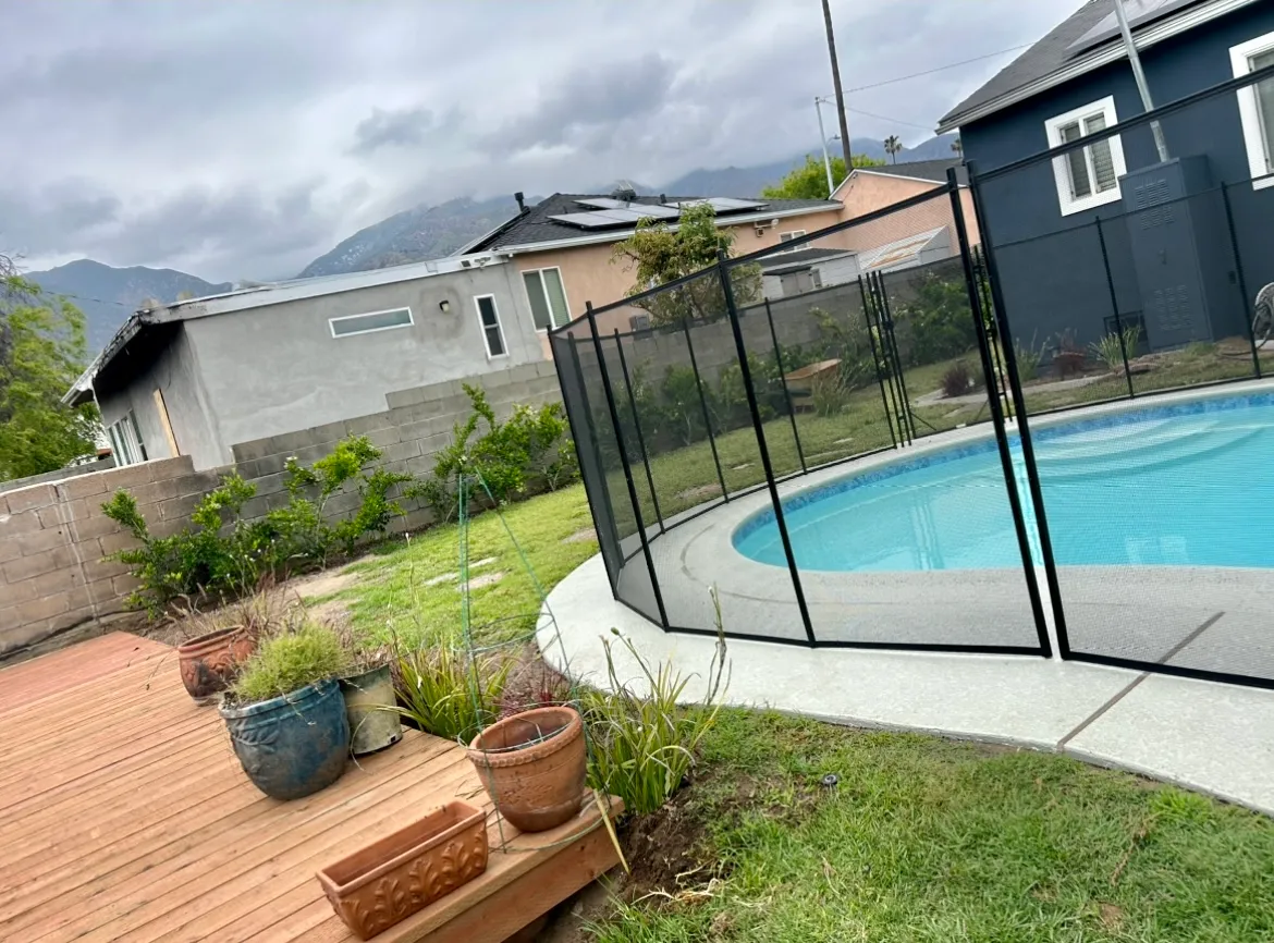 Restored pool with safety fence after Eaton Fire damage restoration