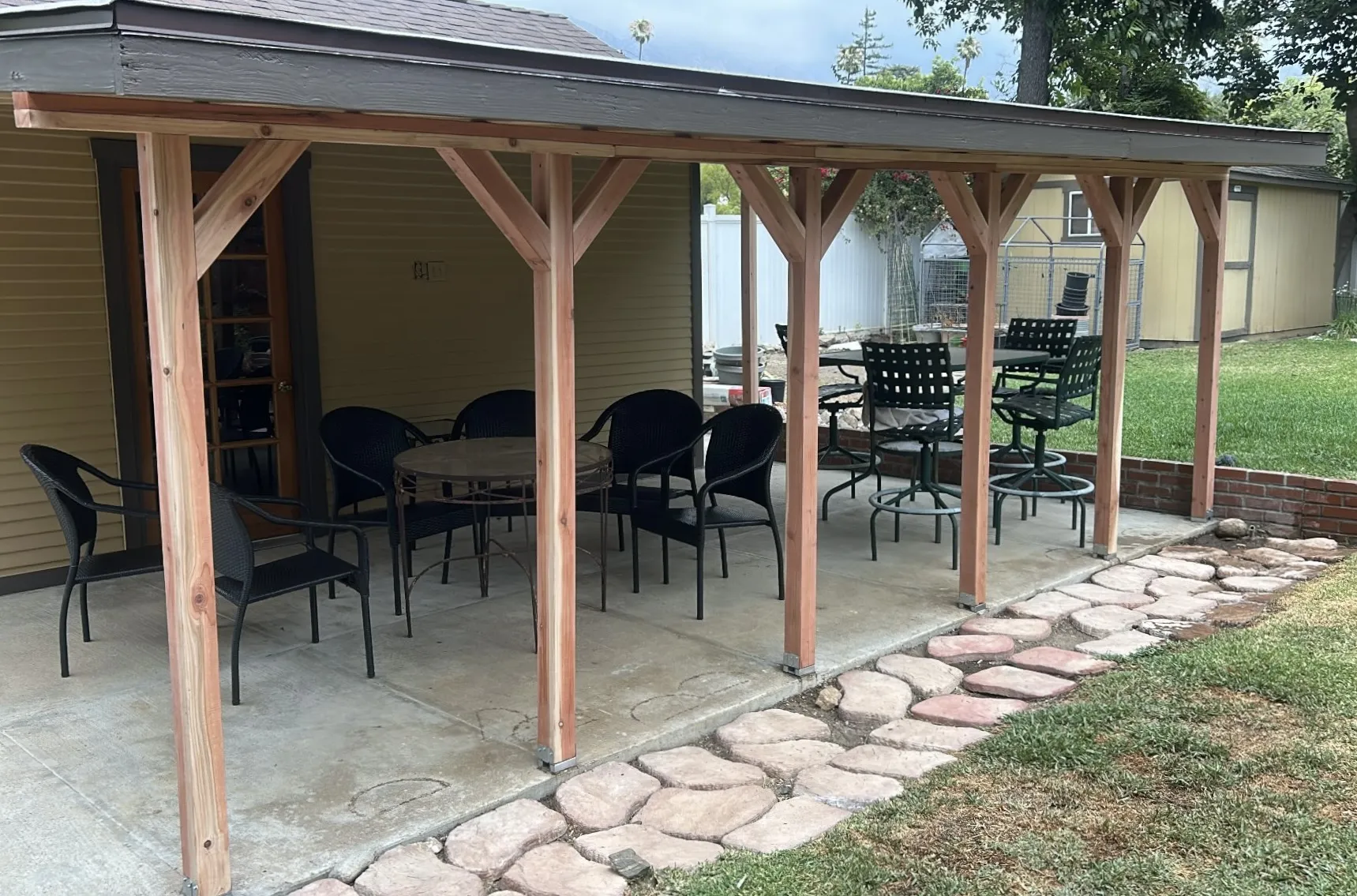 Large covered patio with wood post structure
