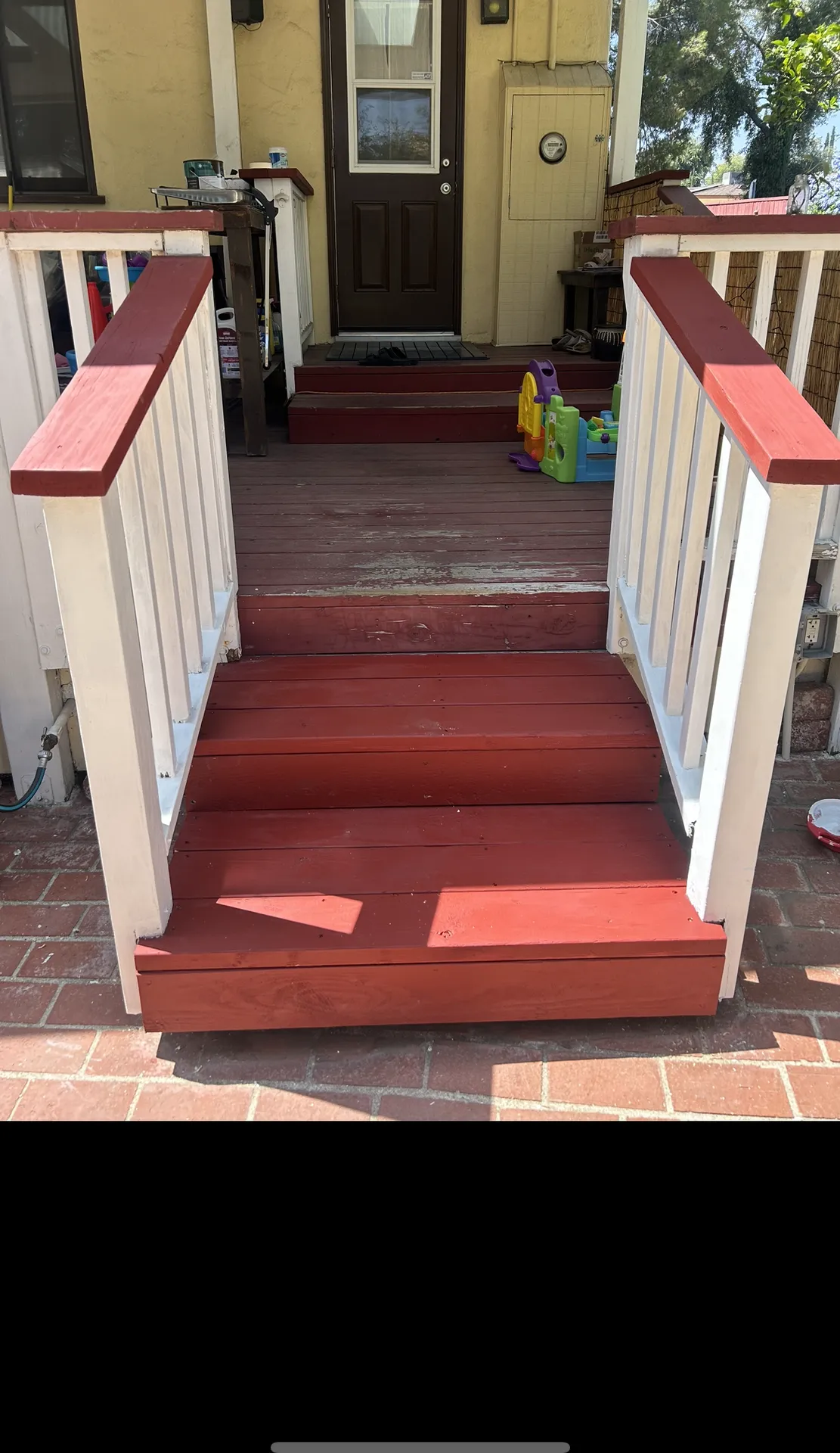 New deck treads with painted railings on front porch