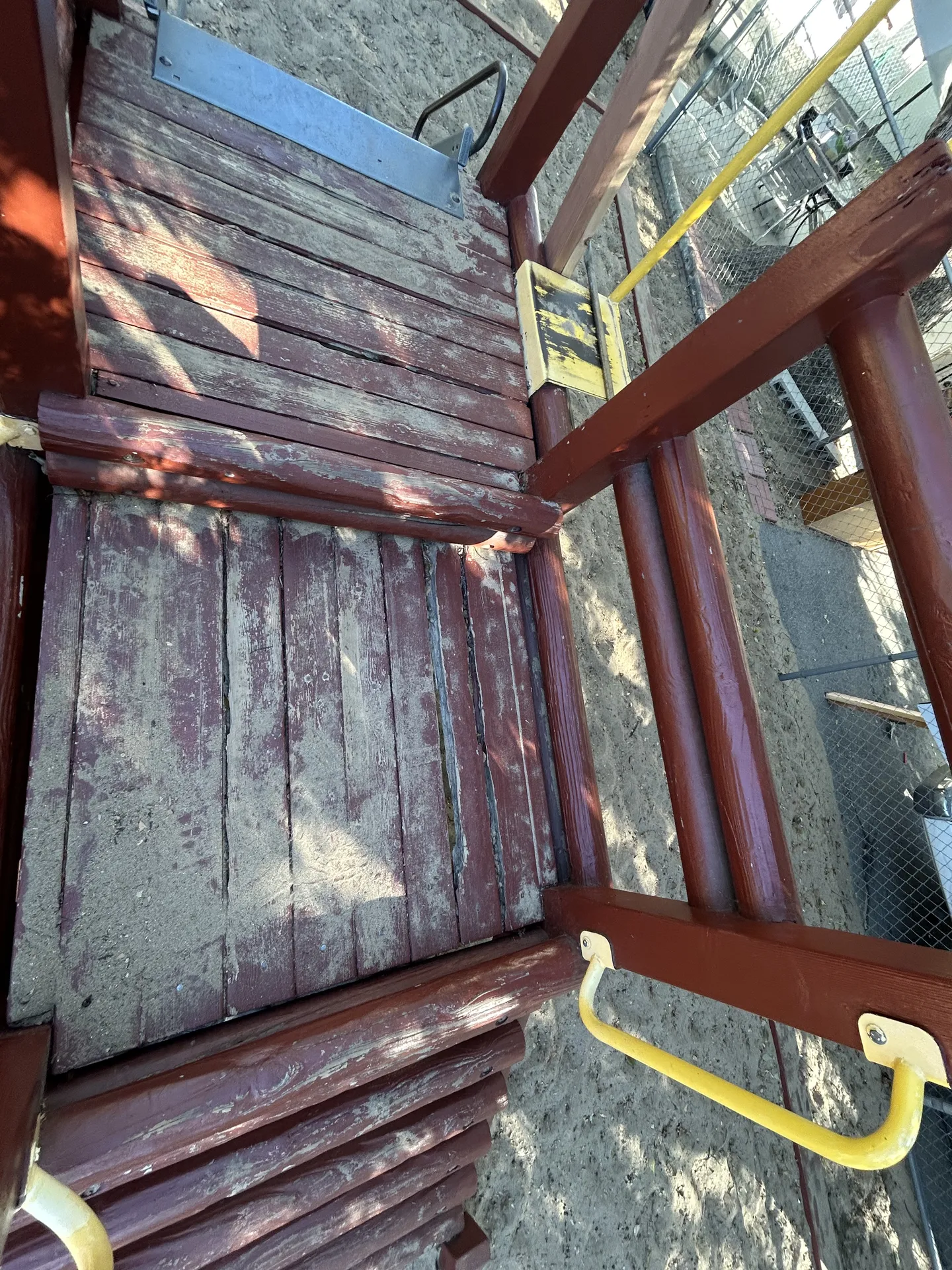 Worn cedar deck planks before replacement