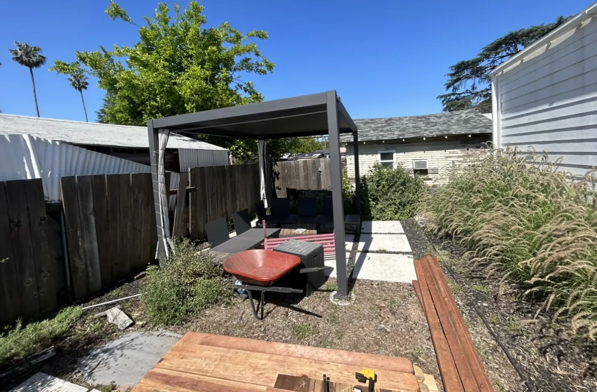 Pergola shade structure on concrete pad